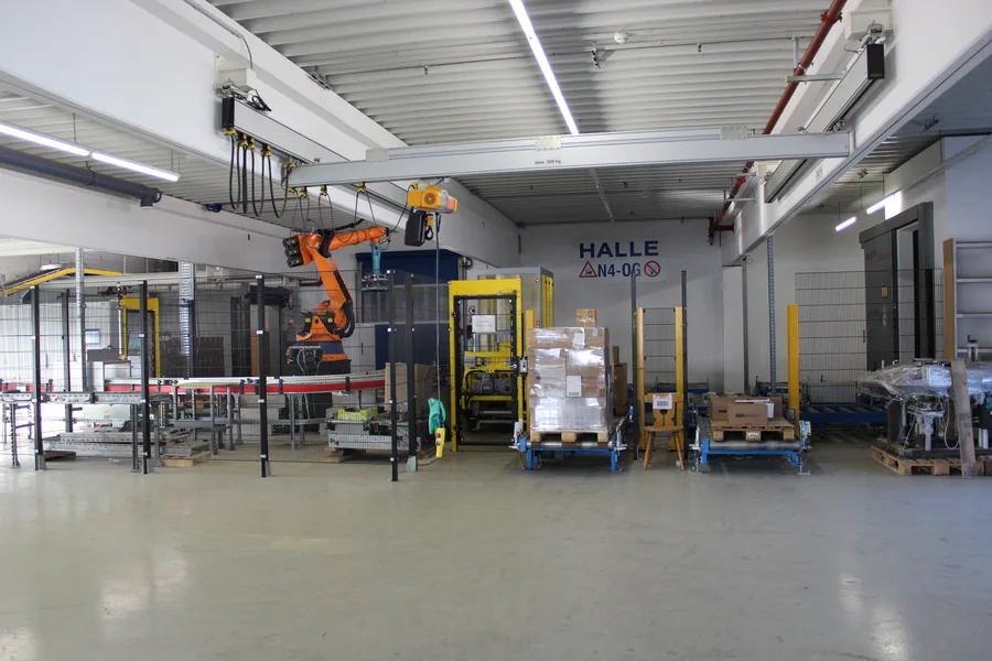 KUKA robot in warehouse hall